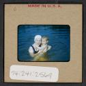 [Mimi Muray swimming with a woman (travel slide)]