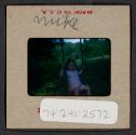 [Mimi Muray on a swing (travel slide)]