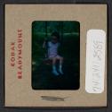 [Mimi Muray on a swing (travel slide)]