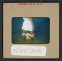 [Mimi Muray swimming with a woman (travel slide)]