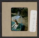 [Mimi Muray playing in a pool (travel slide)]