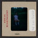 [Mimi Muray on a swing (travel slide)]