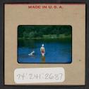 [Woman and Mimi Muray swimming (travel slide)]