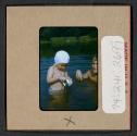 [Mimi Muray and a boy swimming (travel slide)]