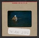 [Mimi Muray and a boy swimming (travel slide)]
