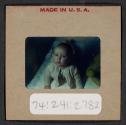 [Mimi Muray in a crib (travel slide)]
