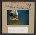 [Mimi Muray swimming with a woman (travel slide)]