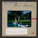 [Peggy Muray seated next to a pool (travel slide)]