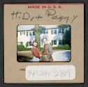 [Peggy Muray and Henry Dreyfuss standing outdoors (travel slide)]