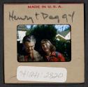 [Henry Dreyfuss and Peggy Muray standing outdoors (travel slide)]