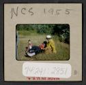 [Nicholas Christopher, Mimi, and Peggy Muray seated outdoors (travel slide)]