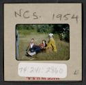 [Nicholas Christopher, Mimi, and Peggy Muray seated outdoors (travel slide)]