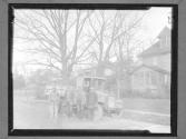 [Men with Truck on Residential Street]
