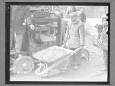 [Man with Wheel Barrel]