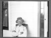 [Man on a Porch]