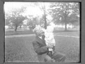 [Man Holding a Baby]