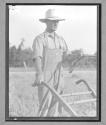 [Farmer Walking with Plow]
