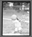 [Small Child with Basketball]