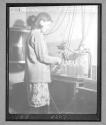 Young Girl Working in Bottle Factory