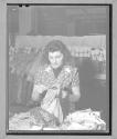 [Woman Holding Fabric]