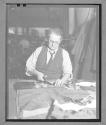 [Man Cutting Fabric]