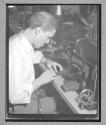[Man Sewing Zippers]