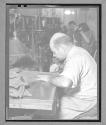 [Older Man Sewing]