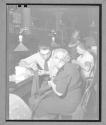 [Man and Woman Sewing]