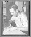 [Man Sewing]