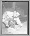 [Man with Cutting Machine]