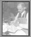 [Man Sewing]