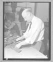 [Older Man with Hand Tool]