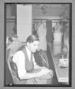 [Man Hand-Sewing]