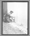 Worker adjusting girder