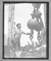 Worker Holding Hook Globe