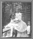 [Girl Holding Small Boy]