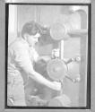 Workman Closing Door of Vault