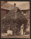 [Two girls by a well]