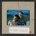 [Nicholas Christopher and Mimi Muray on a beach (travel slide)]