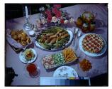 [Table spread of dinner and dessert]