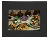 [Table spread of dinner with hands]