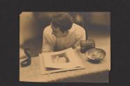 [Nickolas Muray with a photograph of Eva LeGallienne]