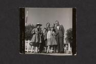[Nickolas, Mimi, Peggy, and Nicholas Christopher Muray with others]