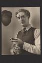 [Nickolas Muray holding light meter]