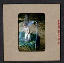 [Mimi Muray playing in a pool (travel slide)]
