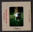 [Mimi Muray on a slide (travel slide)]