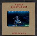 [Mimi Muray playing outdoors (travel slide)]