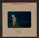[Mimi Muray and a boy swimming (travel slide)]