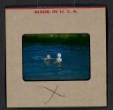 [Mimi Muray and a boy swimming (travel slide)]