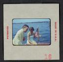 [Nicholas Christopher Muray and a woman on a boat (travel slide)]